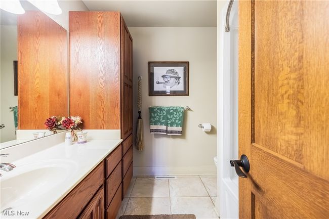 Bathroom with baseboards, toilet, vanity | Image 36