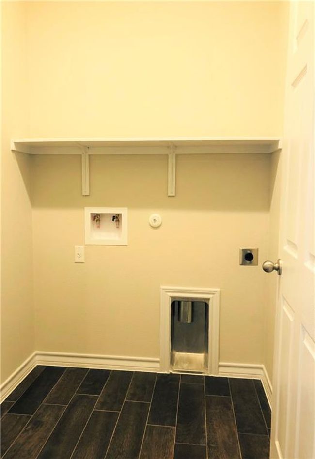 Laundry area with electric dryer hookup, hookup for a gas dryer, and washer hookup | Image 12