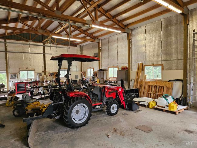 Garage featuring a workshop area | Image 29