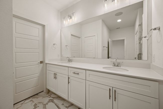 Bathroom with marble finish floor, a sink, recessed lighting, and double vanity | Image 29
