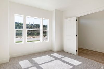 Spare room with a wealth of natural light and light hardwood / wood-style flooring | Image 3