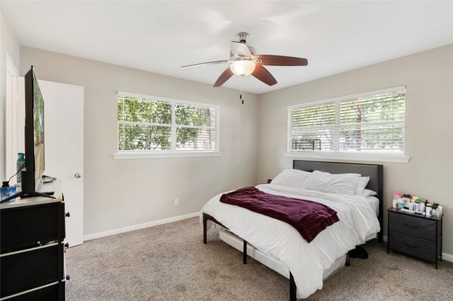 Bedroom featuring carpet, baseboards, and ceiling fan | Image 10