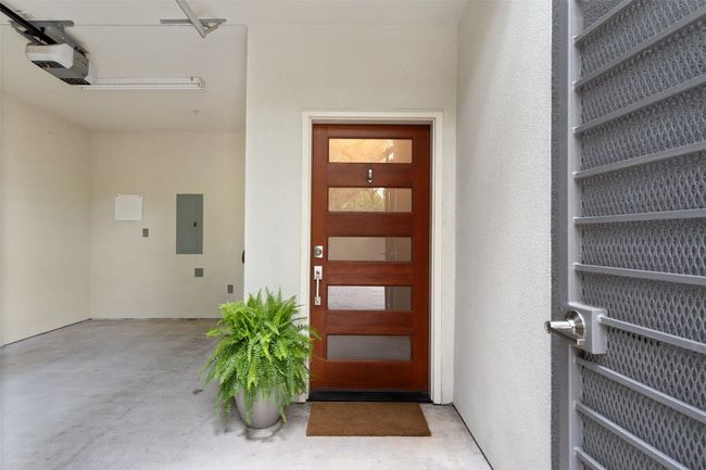 Front door to property with a 1-car garage | Image 5