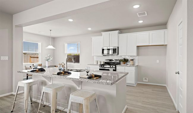 Kitchen with island (*Photo not of actual home and used for illustration purposes only.) | Image 7