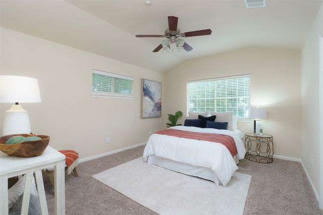 Bedroom with vaulted ceiling, carpet, a ceiling fan, and baseboards | Image 9