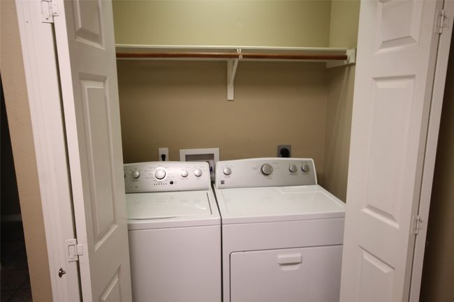 Laundry area with washer and clothes dryer | Image 4