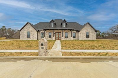 French provincial home featuring a front lawn | Image 1