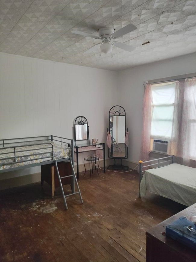 Bedroom with hardwood / wood-style floors, cooling unit, and ceiling fan | Image 12