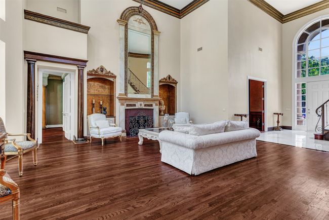 19' ceilings give the room a graceful and elegant feel, and all the windows ensure plenty of natural light to keep it bright and energetic. | Image 7