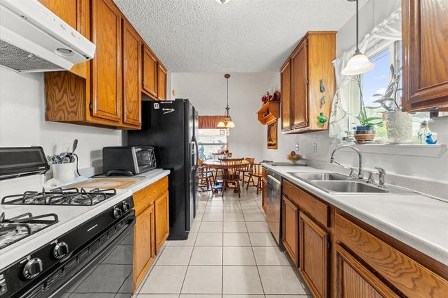 Light and Bright kitchen with plenty of cabinet space and a window above your sink! | Image 15