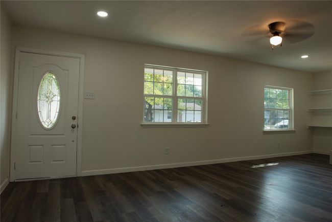 Foyer featuring ceiling fan, a healthy amount of sunlight, and dark hardwood / wood-style floors | Image 5