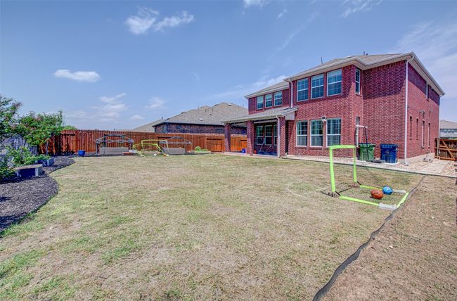 Back of property with a fenced backyard, brick siding, and a lawn | Image 29