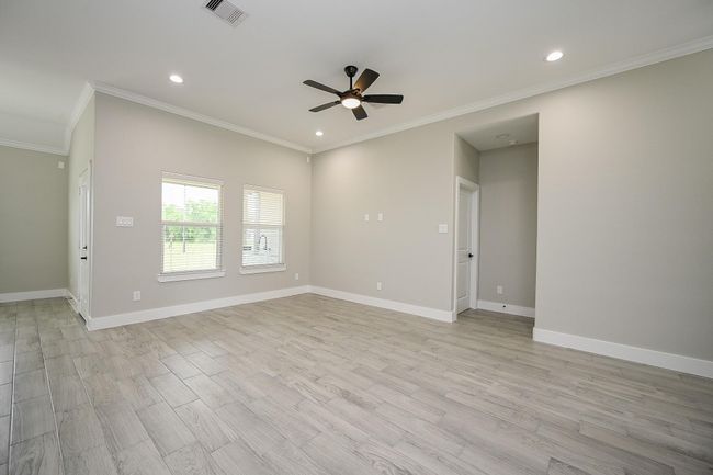 Come Home & Enjoy This Spacious Living Room That Looks Out To The Backyard With A Ceiling Fan For An Inside Breeze To Keep Cool | Image 7
