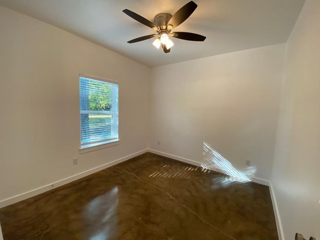 Empty room featuring baseboards and a ceiling fan | Image 14