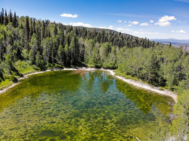 Property view of water with a mountain view and a wooded view | Image 23