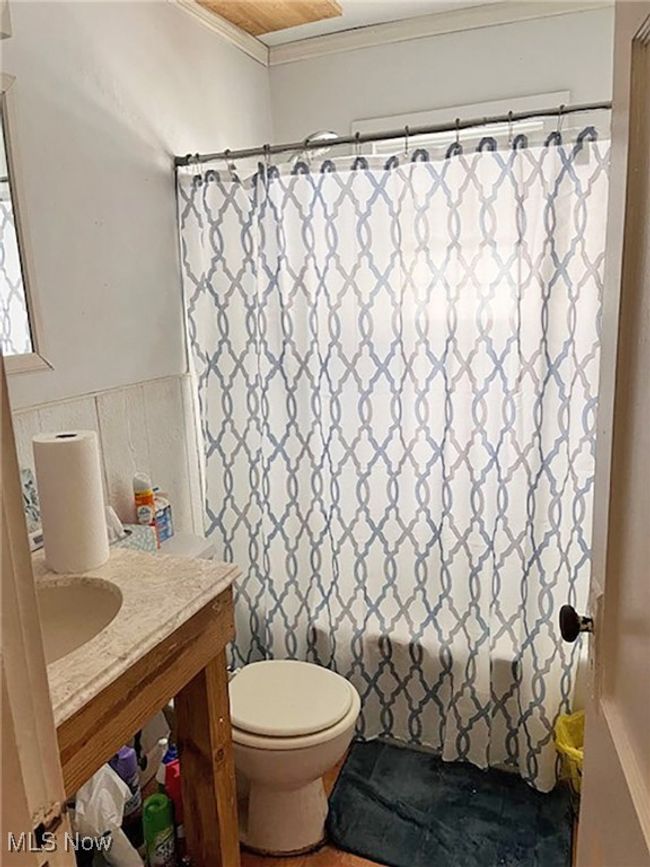 Bathroom featuring vanity, toilet, and crown molding | Image 15