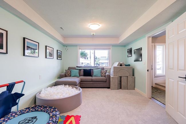 Carpeted living room featuring baseboards | Image 31