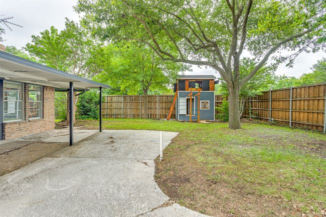 Fenced backyard featuring a patio area and an outdoor structure | Image 17