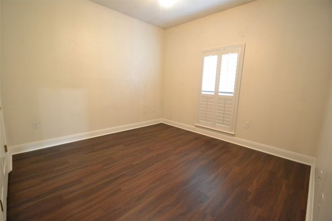 Empty room featuring dark wood-type flooring and baseboards | Image 17