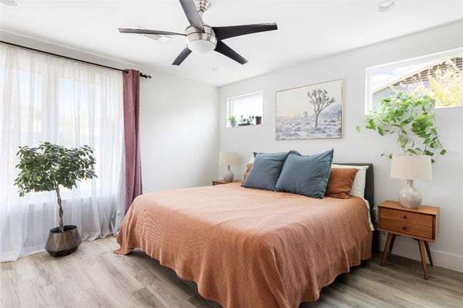 Spacious primary bedroom features oversized windows and gorgeous natural light. | Image 5