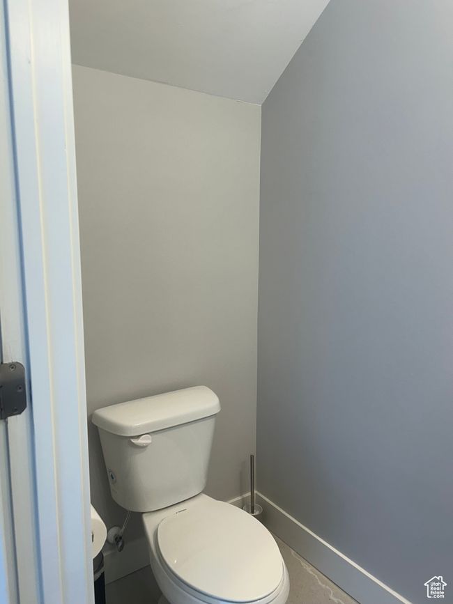 Bathroom featuring baseboards and toilet | Image 29