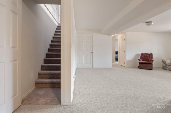 Stairs with carpet and baseboards | Image 21
