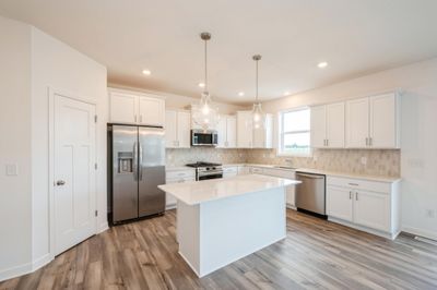 (Photo of inventory home, actual features may vary) The spacious and sleek design is perfect for home chefs to gather | Image 3