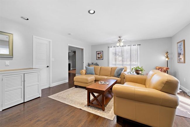 Living area featuring recessed lighting, dark wood finished floors, and baseboards | Image 21