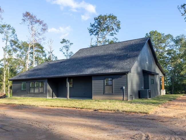 From this angle, appreciate the size of the lot and the privacy provided by the wooded surroundings—perfect for those looking for peace and space. | Image 36