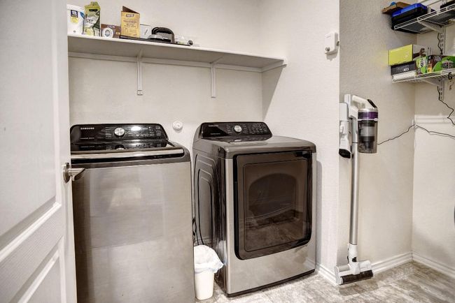 Washroom with washer and clothes dryer and baseboards | Image 32