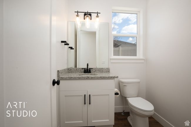 Bathroom with vanity, hardwood / wood-style floors, and toilet | Image 16