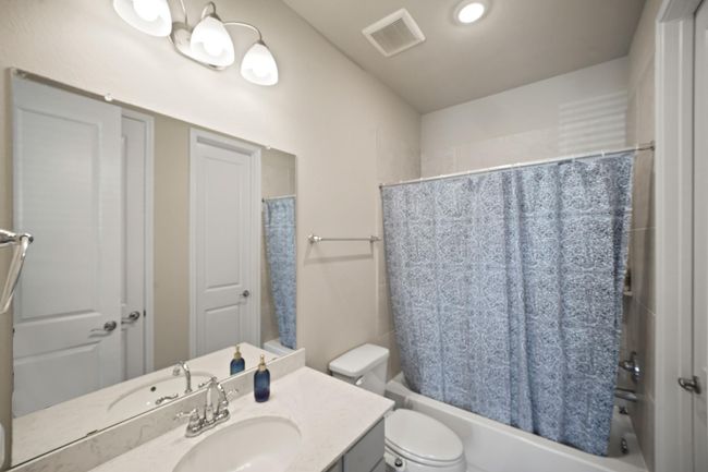 Secondary bathroom features atub/shower combo and vanitywith plenty of counter space. | Image 27