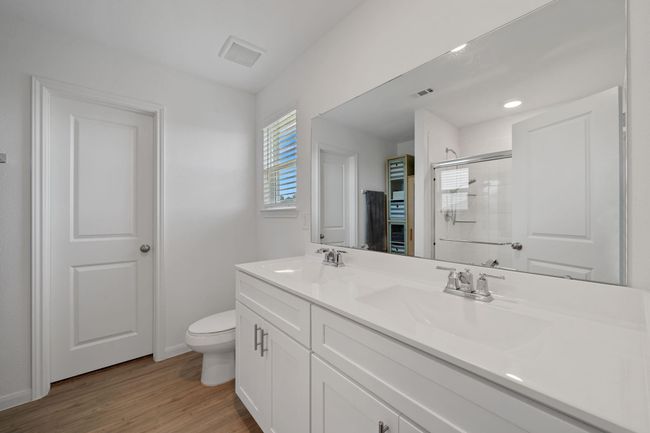 Elegant dual vanity setup offers ample space and style in the primary bath. | Image 27