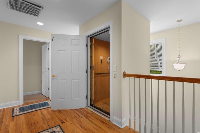 Hall with wood finished floors, baseboards, and recessed lighting | Image 26
