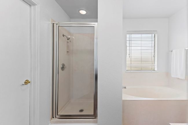 Bathroom with a stall shower and a garden tub | Image 31