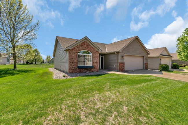 2 stall garage with a driveway to accommodate more vehicles. | Image 21