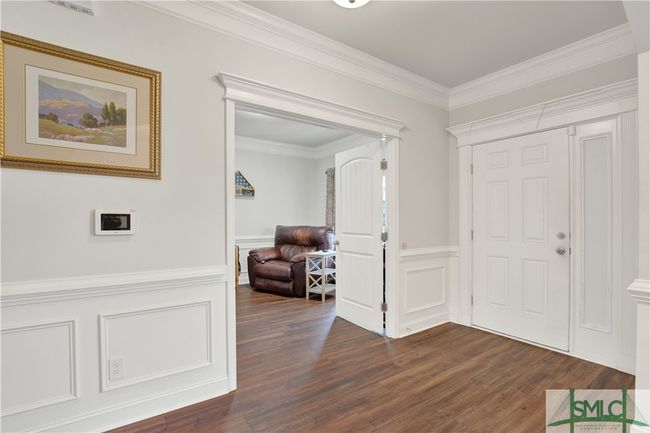 Gorgeous molding in Foyer Entrance looking into Flex room | Image 25