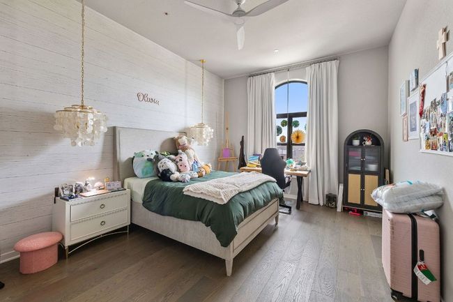 Bedroom with dark wood-type flooring and ceiling fan | Image 31