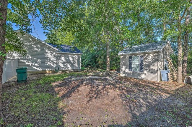 View of yard with an outdoor structure | Image 5
