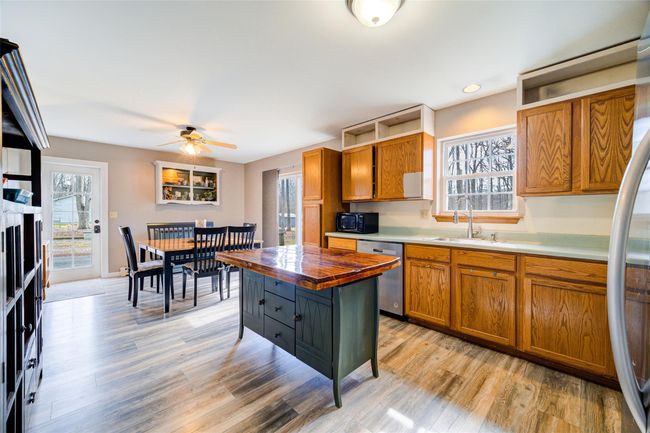 Kitchen featuring a window over the sink, and a dishwasher | Image 14