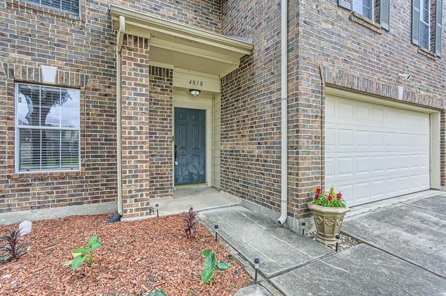 Small covered front porch greets you when you arrive. | Image 5