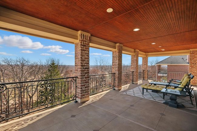 The top floor covered wrap around porch has views all the way to Legacy. This is the perfect spot on July 4th! | Image 26