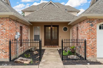 Doorway to property featuring covered porch | Image 2