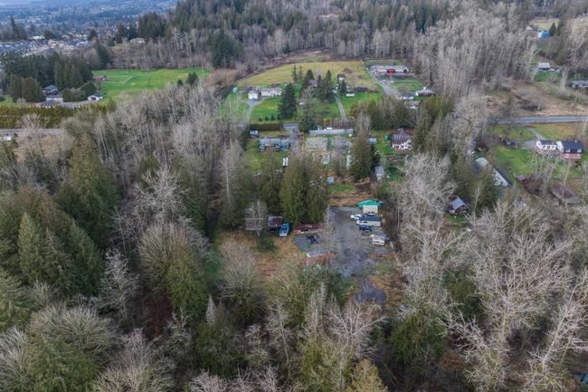 Aerial view featuring a wooded view | Image 4