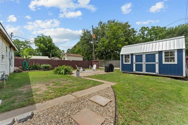 Oversized backyard featuring a storage shed—perfect for tools, hobbies, or keeping things neat and organized. | Image 22