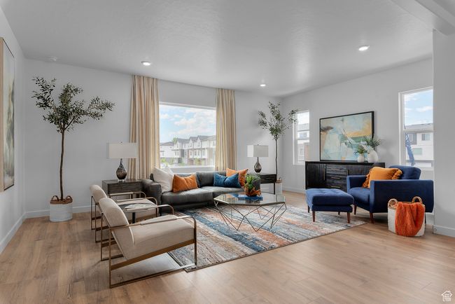 Living room with light wood-style flooring and recessed lighting | Image 6