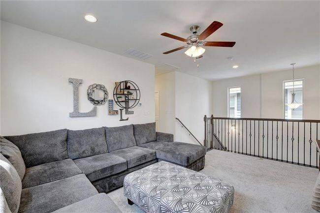 Living area featuring carpet flooring, recessed lighting, and ceiling fan | Image 16