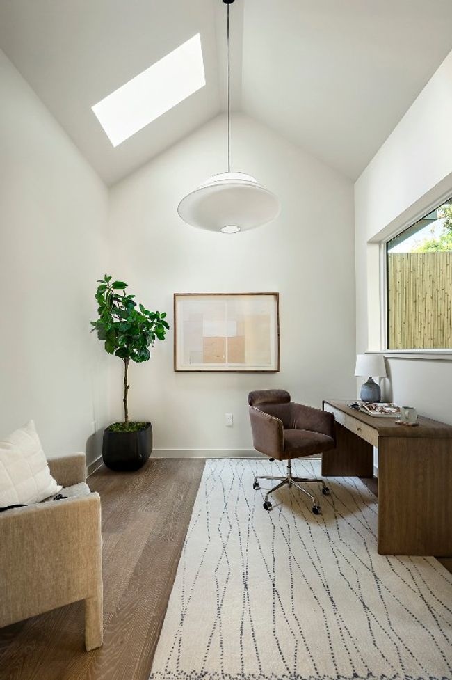 Office featuring lofted ceiling and a skylight | Image 10