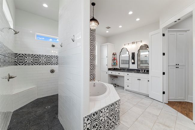 Bathroom featuring visible vents, walk in shower, a tub with jets, recessed lighting, and vanity | Image 12