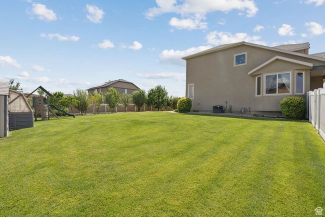 View of yard featuring a playground | Image 48